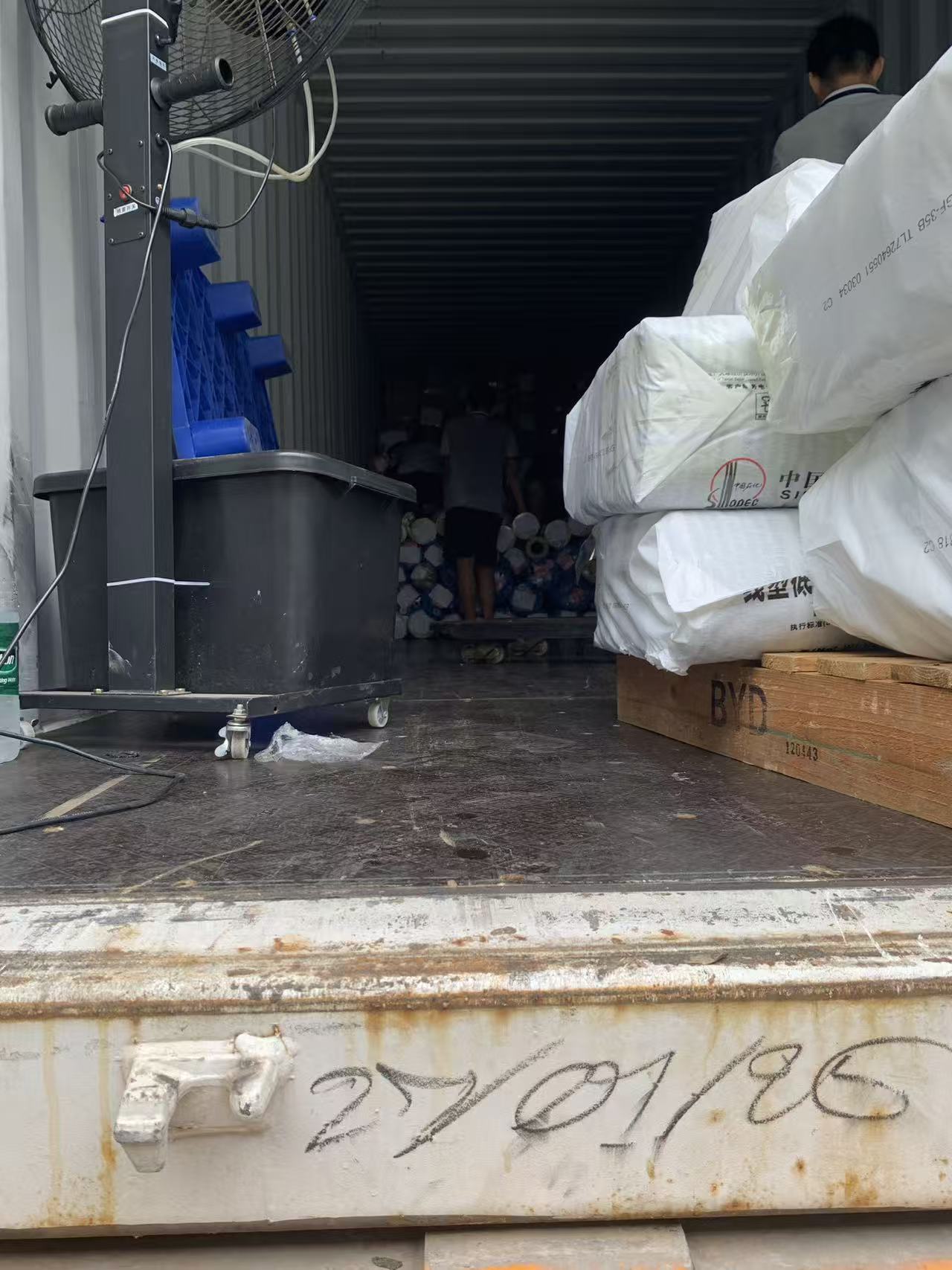 Palletized SINOPEC linear low density polyethylene (LLDPE) resin bags stacked inside Sealock raw material warehouse.