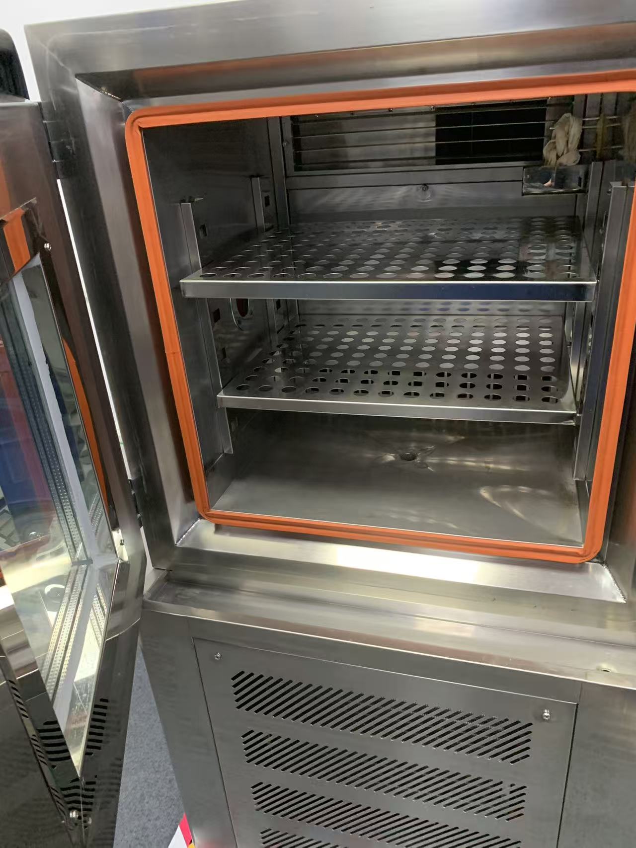 Interior of the test chamber with perforated shelves